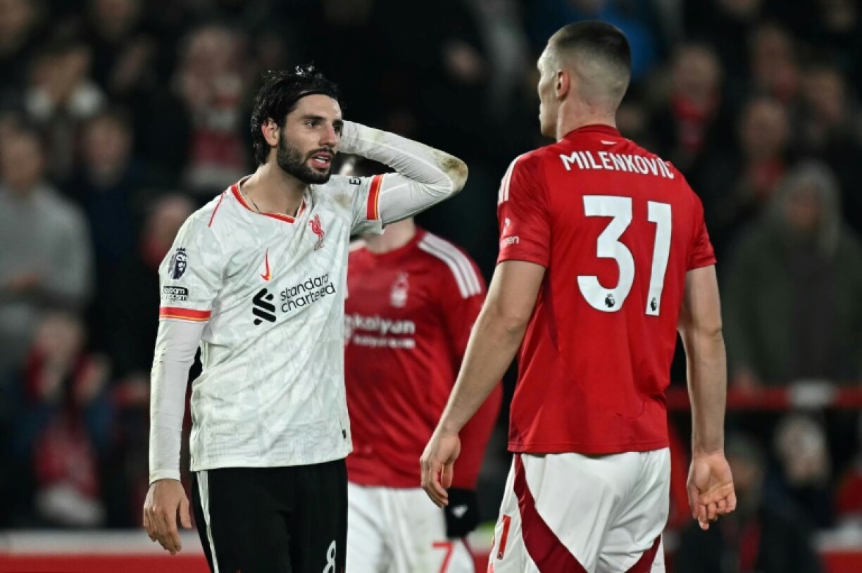 Liverpool's Dominik Szoboszlai (L) shows his frustration during the draw at Nottingham Forest