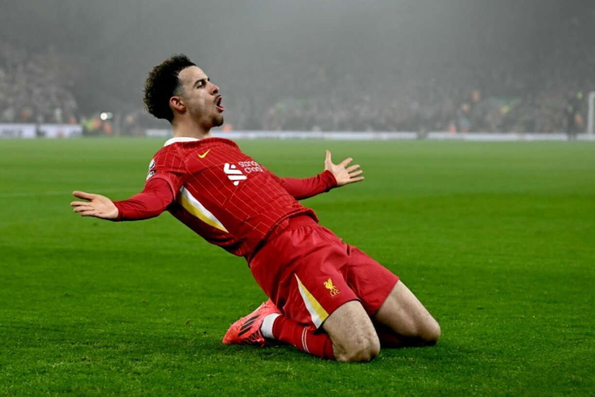Liverpool midfielder Curtis Jones celebrates scoring against Leicester