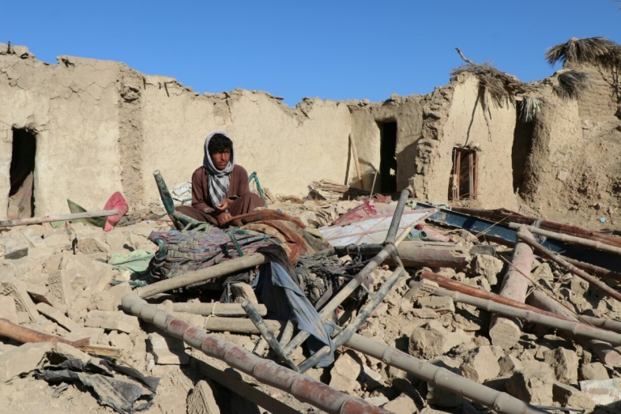 A resident sits at a damaged house after an air strike Afghanistan's Taliban government blamed on Pakistan in Jige Mughalgai in Khost province