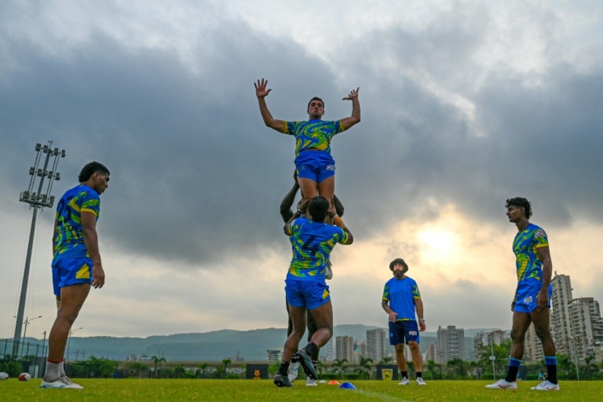 Hyderabad Heroes' players take part in a training session at the Cidco football ground in Kharghar, Navi Mumbai on June 7, 2025, ahead of India's Rugby Premier League