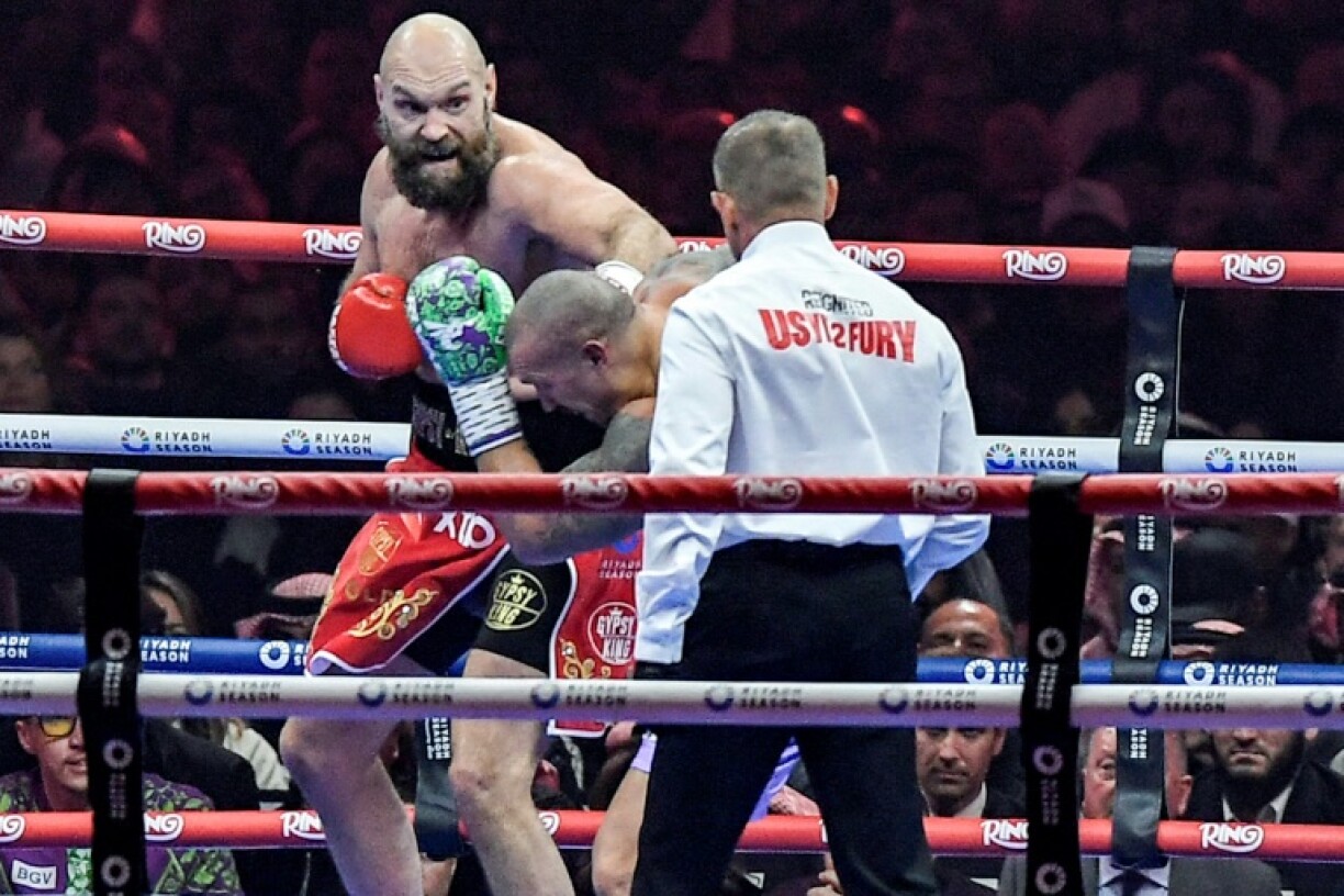 Beaten: Britain's Tyson Fury (red) lost his world heavyweight boxing title match against Oleksandr Usyk on a unanimous points decision