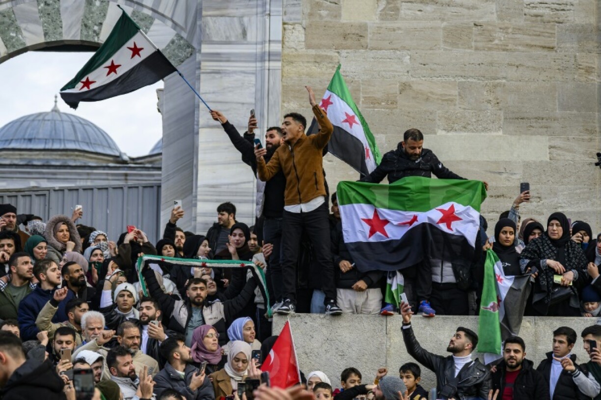 Syrians in Istanbul celebrate the reported fall of the Assad regime