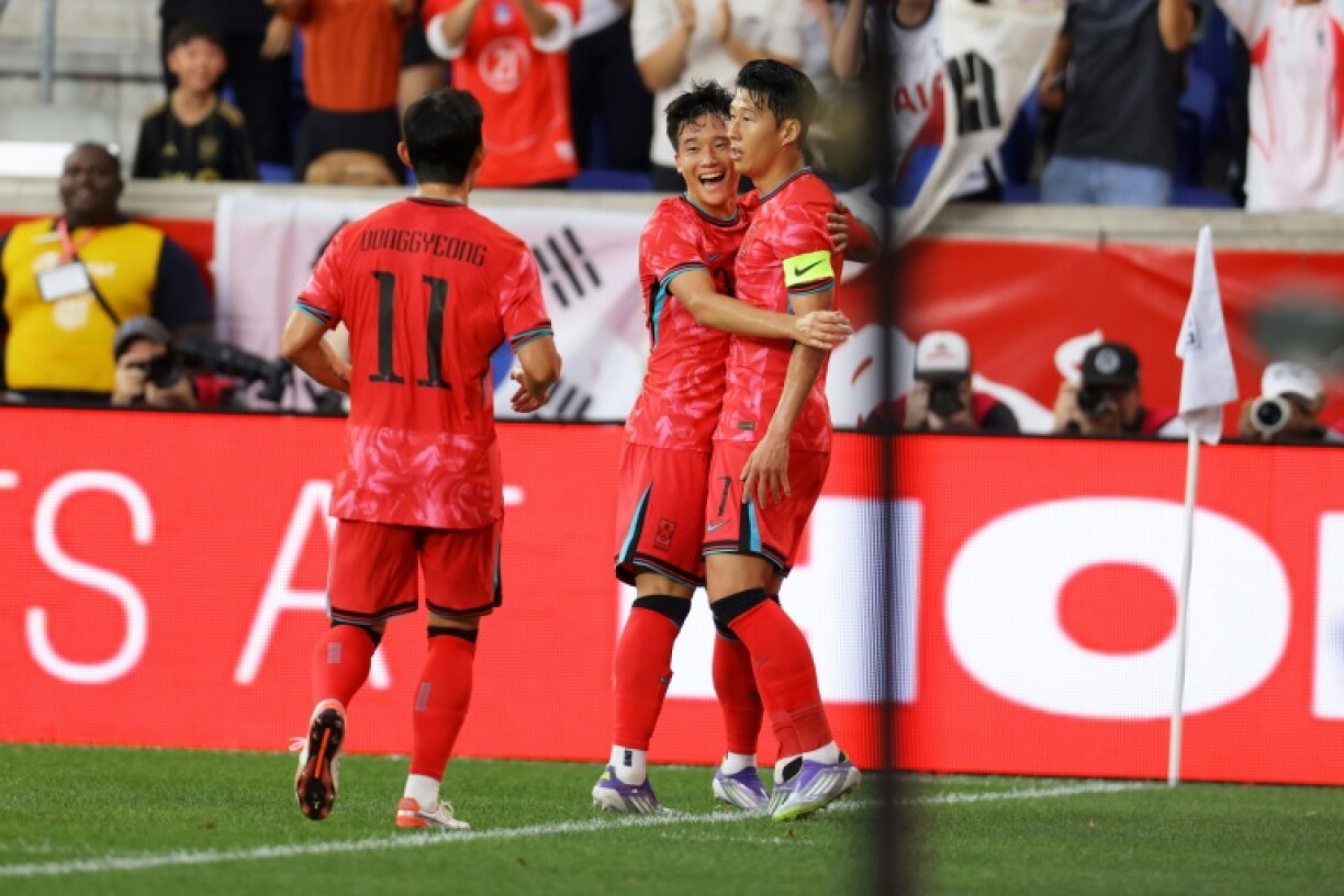Son Heung-min, at right being hugged, celebrates his goal with teammates as South Korea defeated the United States in an international football friendly