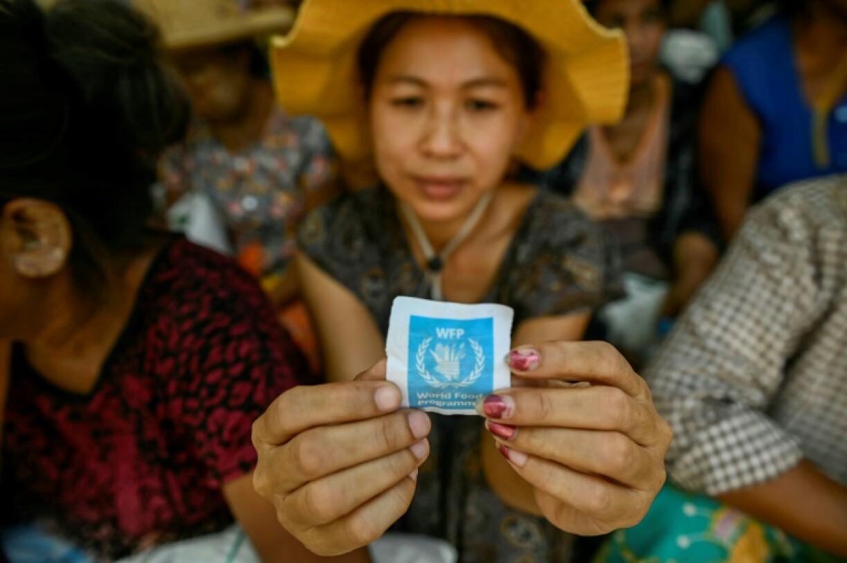 At a World Food Programme site in Sagaing, bags of rice were being handed out to the quake victims