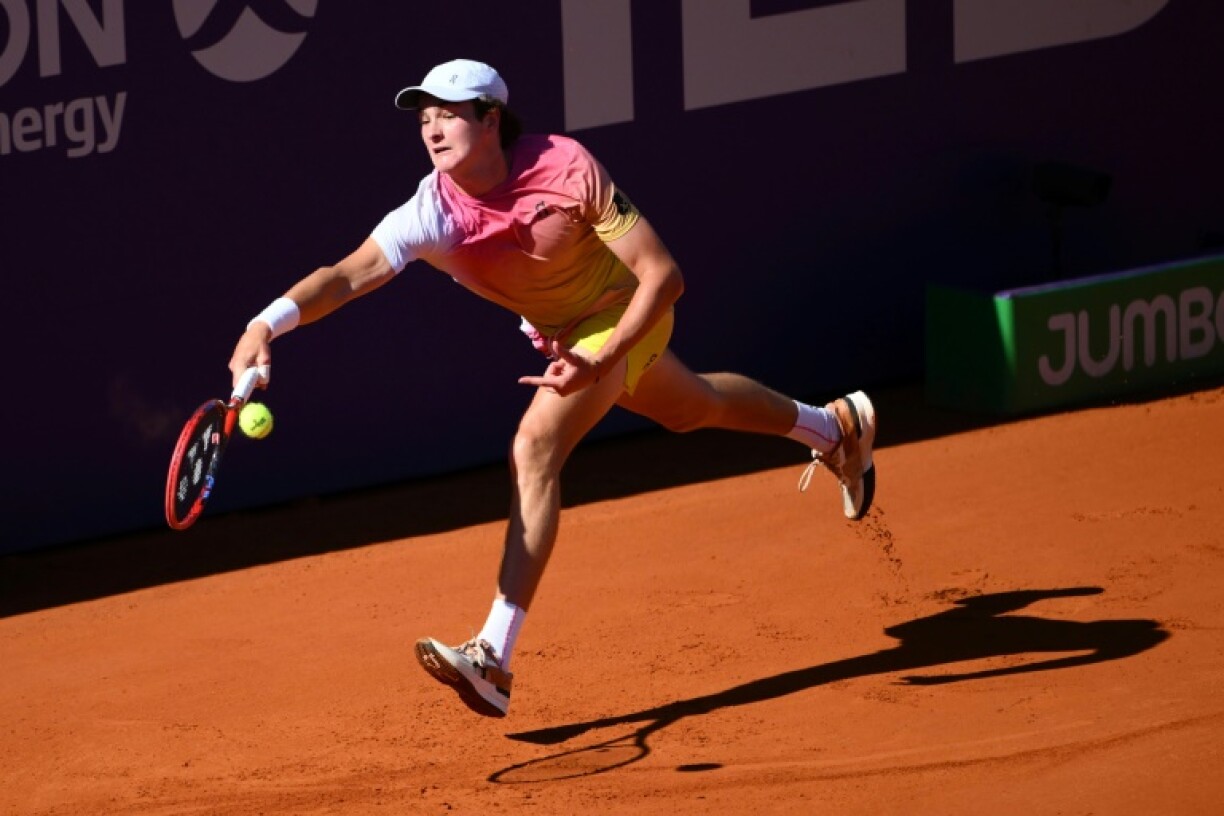 Champion: Brazil's Joao Fonseca returns the ball to Argentina's Francisco Cerundulo in Sunday's Argentina Open final