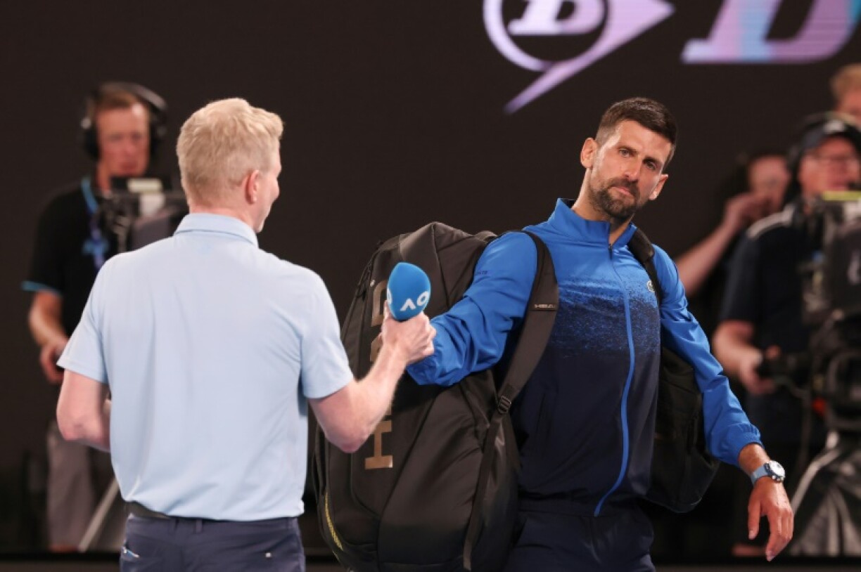 Novak Djokovic (R) refused to do an on-court interview after his last 16 match at the Australian Open
