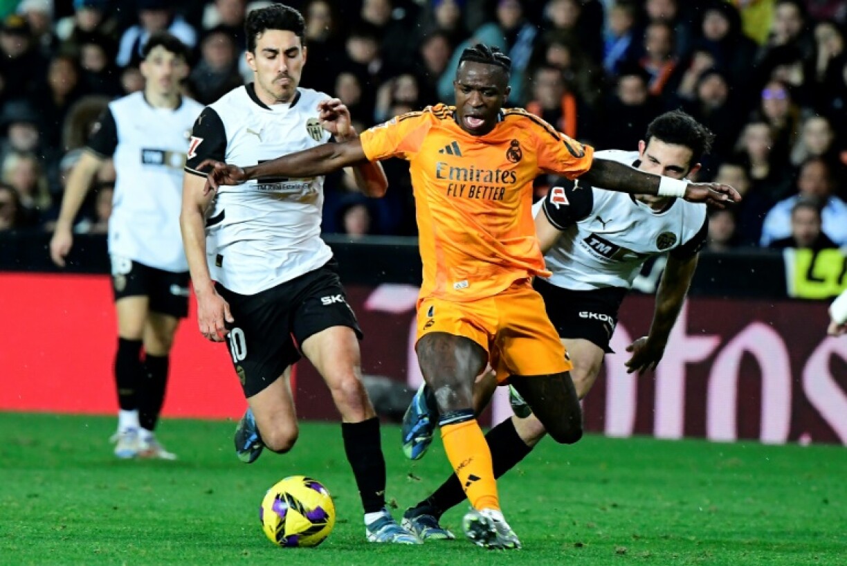 Real Madrid's Brazilian forward Vinicius Junior (C) was sent off in his team's win at Valencia on Friday