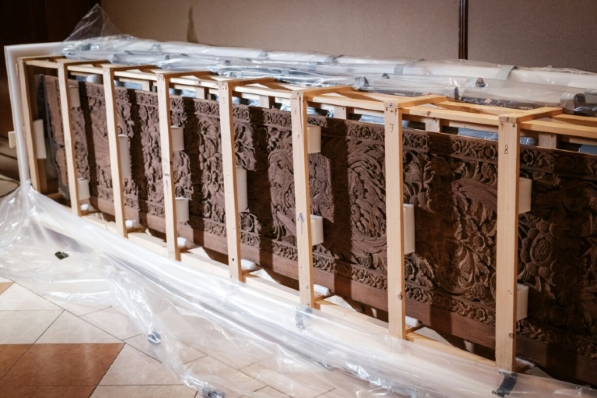 A pair of wooden doors, believed to be war booty from 1906, sit in a crate after being repatriated from the Netherlands