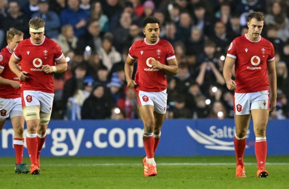 Consolation score: Ben Thomas (C) celebrates after scoring Wales' second try against Scotland at Murrayfield