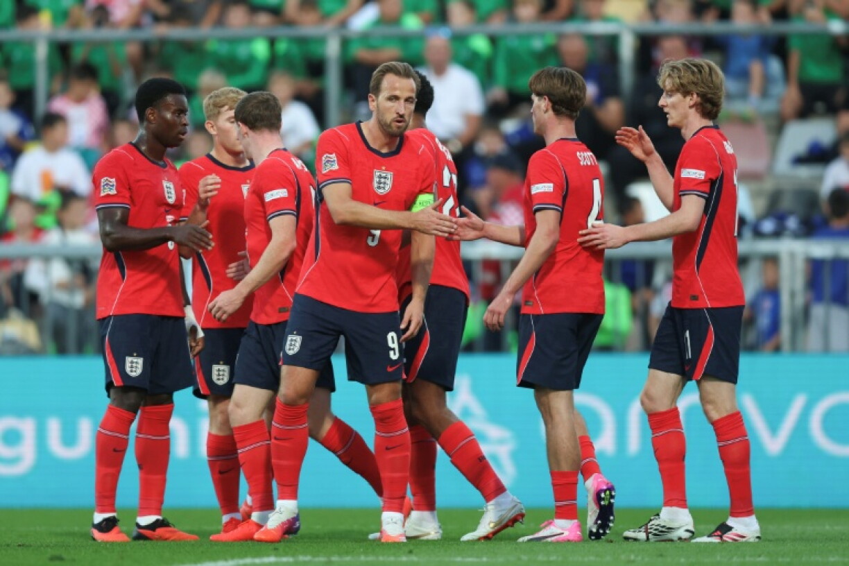 England captain Harry Kane (C) celebrates scoring against Croatia