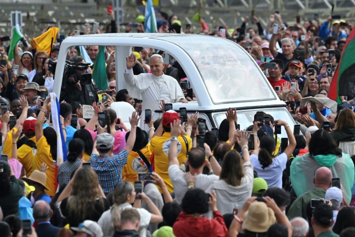 Pope Leo XIV waves to the crowd as he arrives to lead the weekly general audience at St. Peter's square in the Vatican