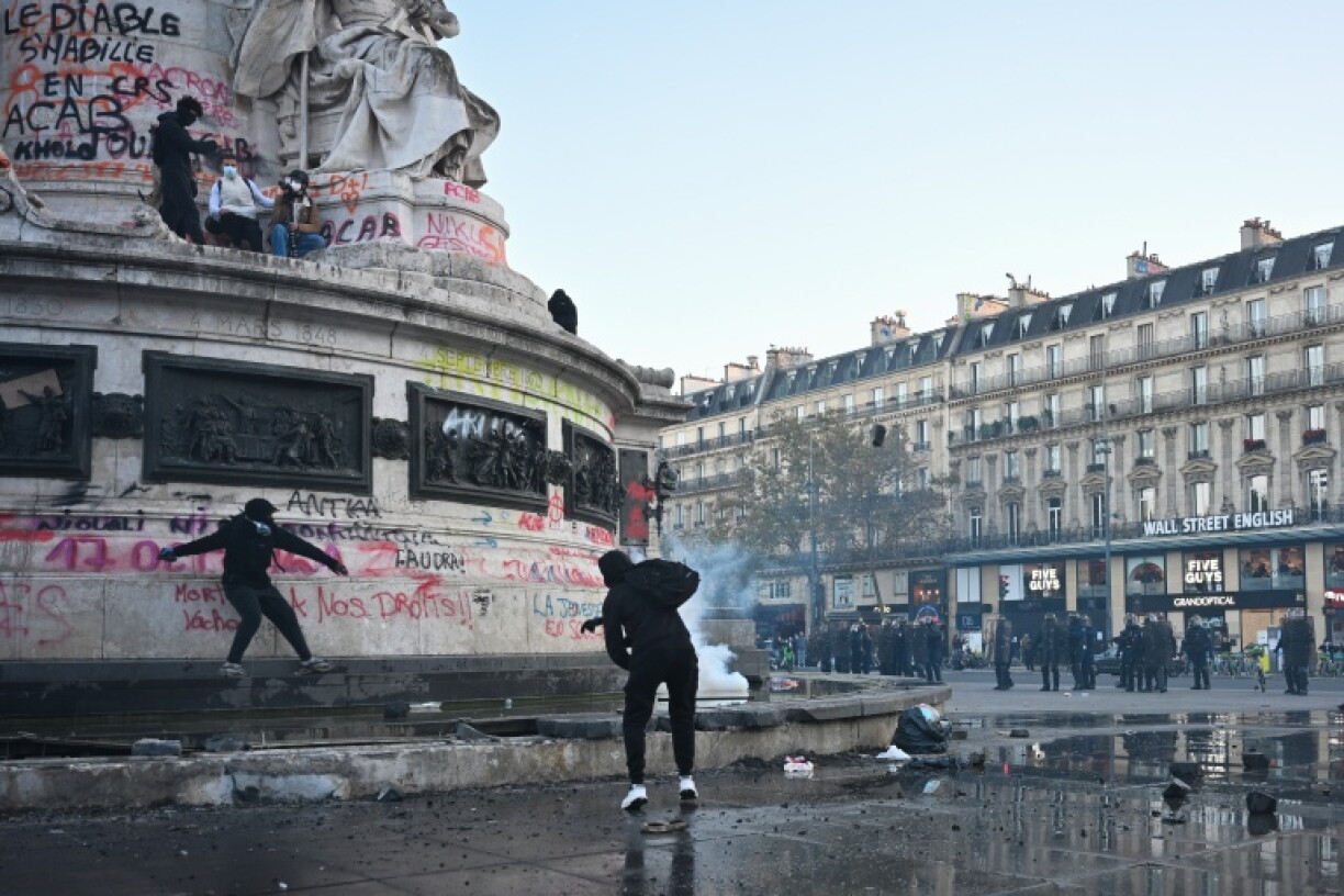 Protesters break up the fountain at the Republique square in a second day of unrest in Paris