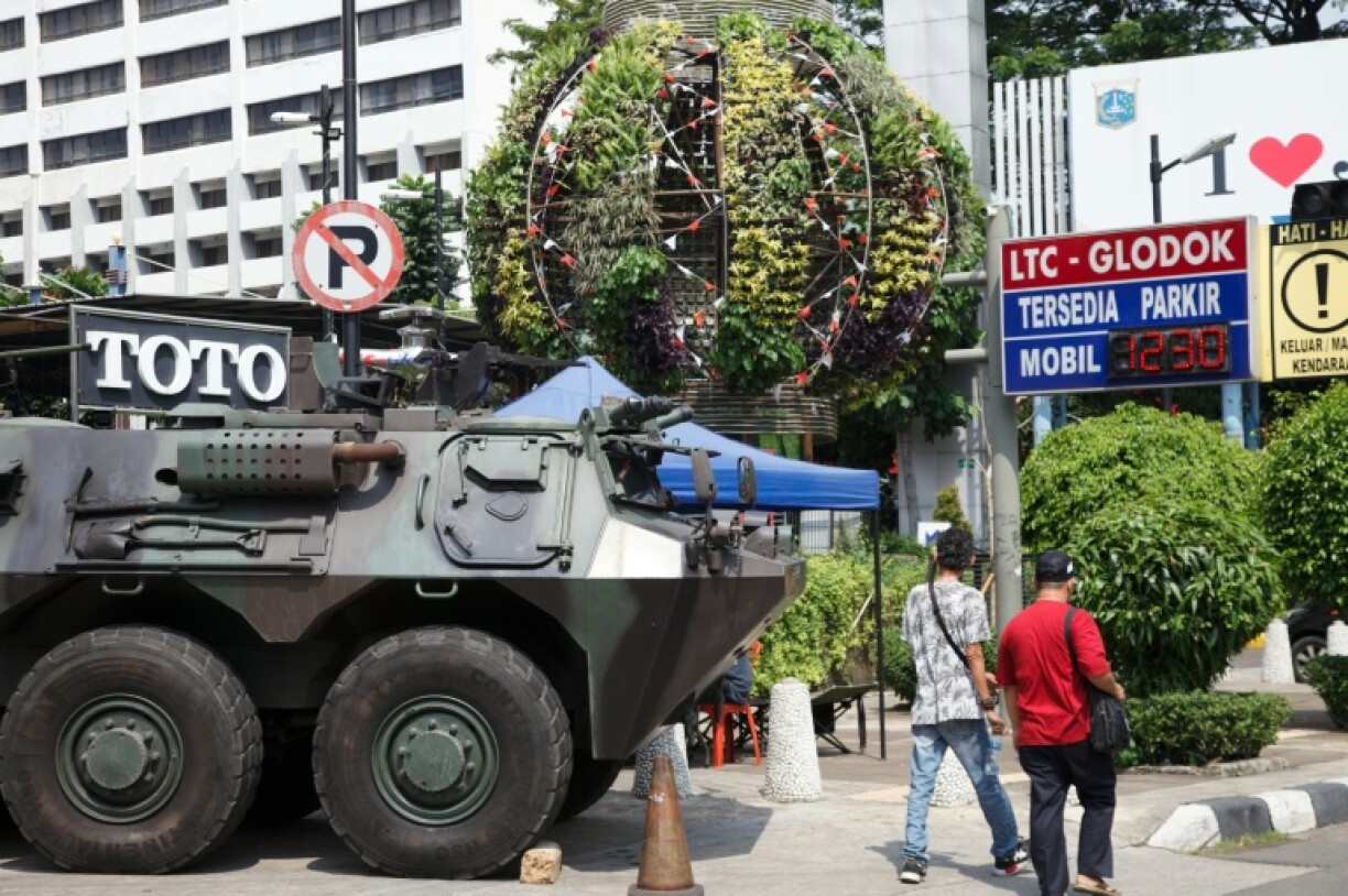 A military armoured vehicle is seen on the roadside in Jakarta