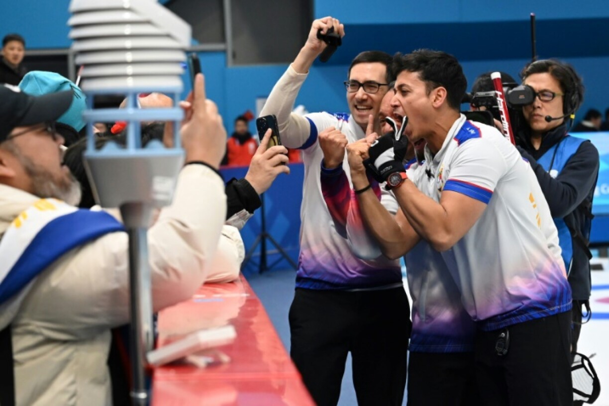Philippines celebrate after winning the men’s gold medal in curling