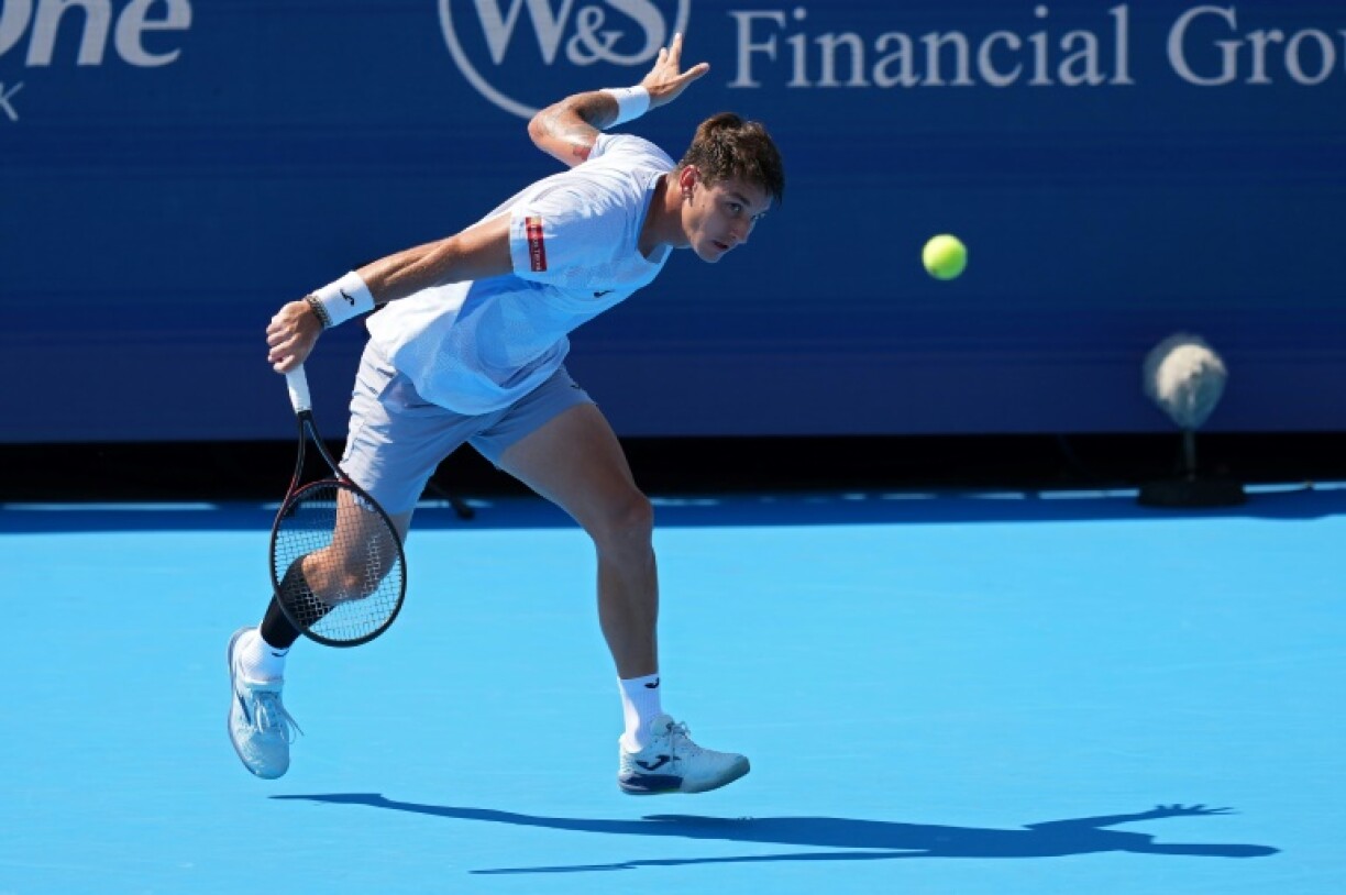 Camilo Ugo Carabelli of Argentina plays a backhand on the way to a victory over Japan's Kei Nishikori at the ATP-WTA Cincinnati Open