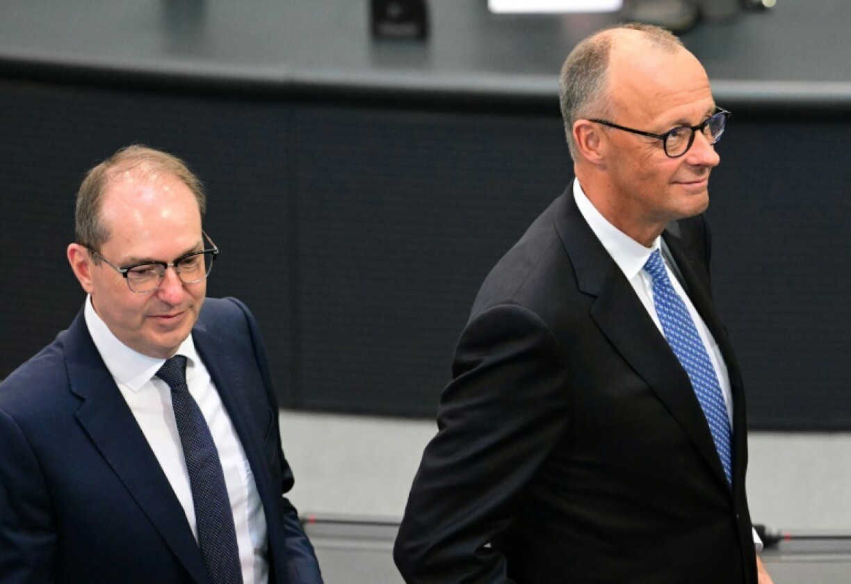 Germany's new Interior Minister Alexander Dobrindt, on the left, with Chancellor Friedrich Merz