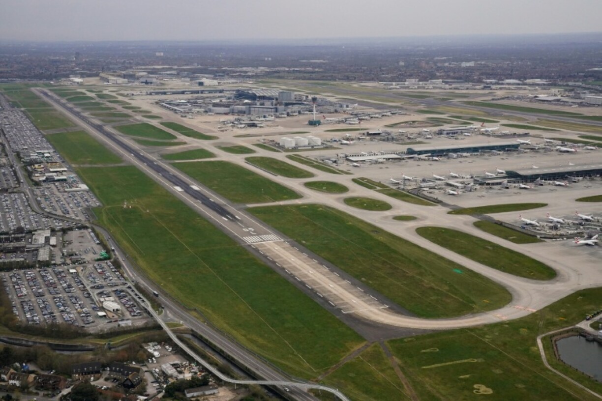 An aerial photograph taken on March 21, 2025 shows planes parked on the tarmac of Heathrow Airport, which has submitted a $49 billion to expand the site and build a third runway