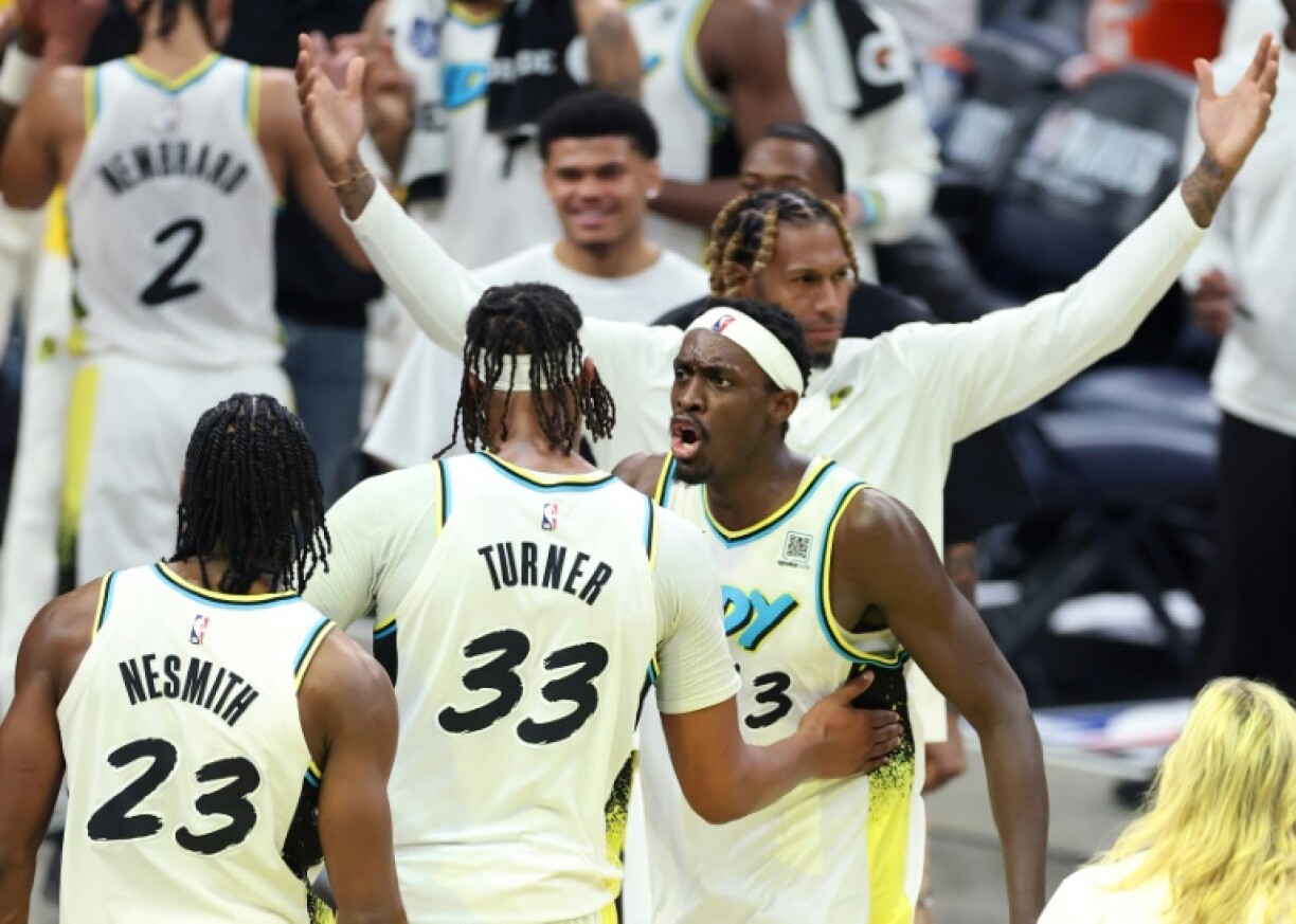 Aaron Nesmith, Myles Turner and Pascal Siakam of the Indiana Pacers celebrate after beating the Milwaukee Bucks in game two of their NBA playoff series
