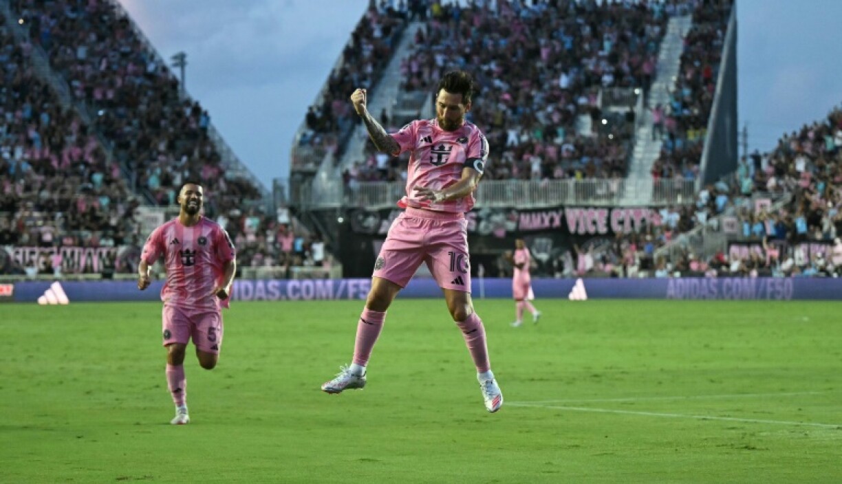 Inter Miami's Argentine star Lionel Messi celebrates after scoring his team's first goal from a direct free kick in a 2-1 Major League Soccer win over Nashville