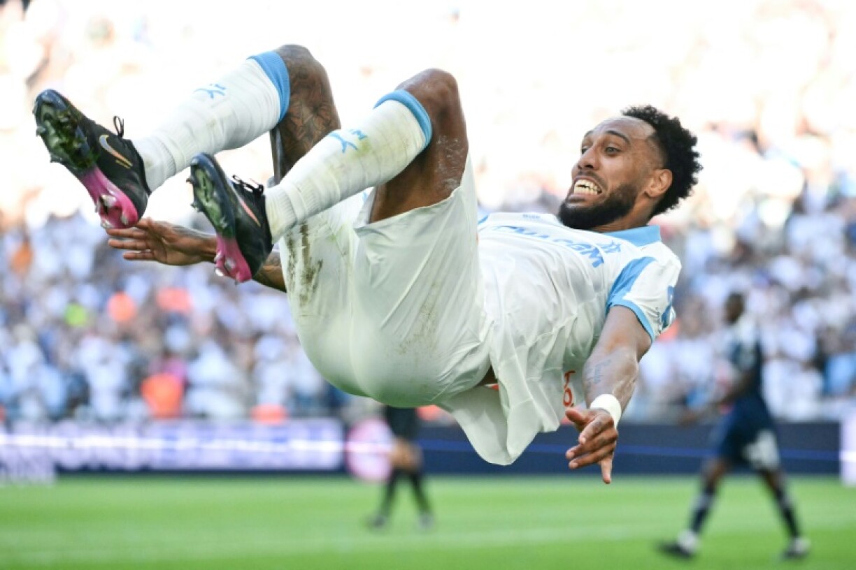 Pierre-Emerick Aubameyang celebrates after scoring one of his two goals in Marseille's 5-2 win over Paris FC on Saturday