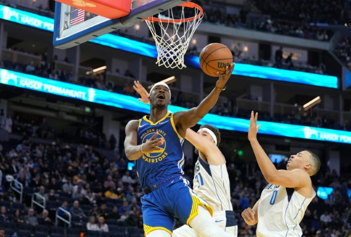 Golden State's Jimmy Butler flies to the basket in the Warriors' NBA victory over the Dallas Mavericks