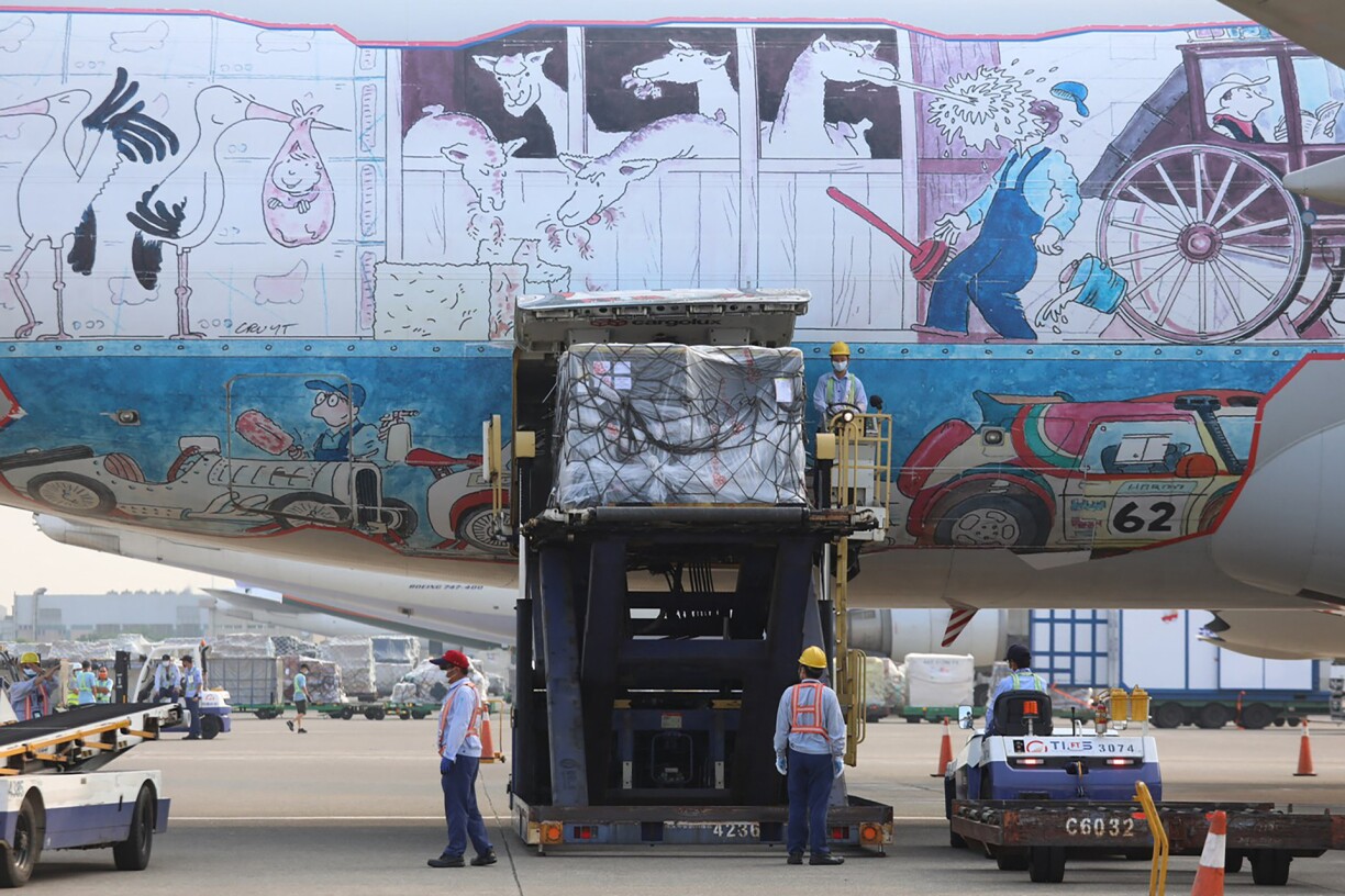 Ground crew unloading the aircraft.