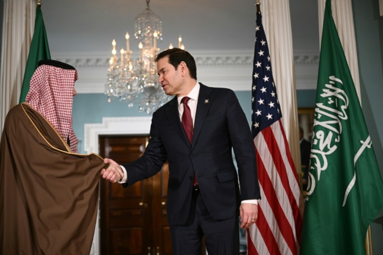 US Secretary of State Marco Rubio shakes hands with Saudi Arabia's Foreign Minister Prince Faisal bin Farhan al-Saud at the State Department