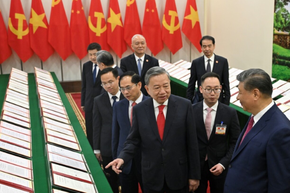 To Lam, centre, said Vietnam was 'always ready to join hands with China'