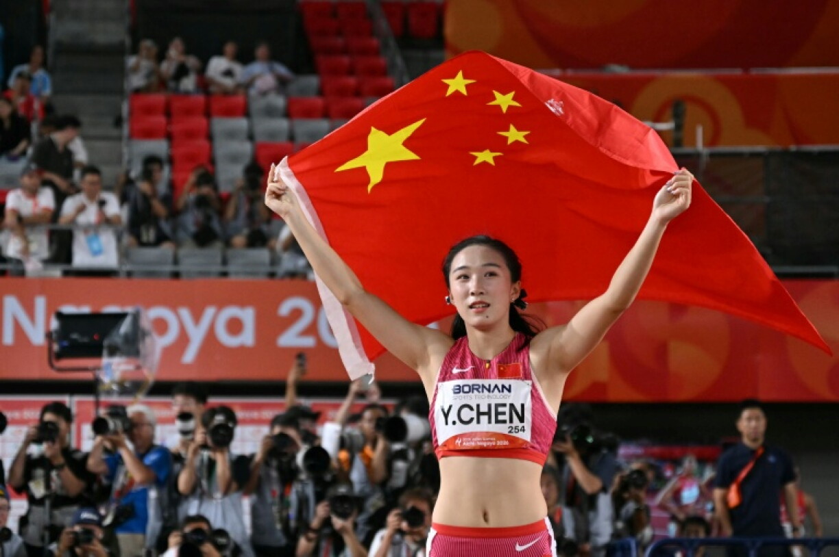 China's Chen Yujie celebrates after winning the women's 100m final