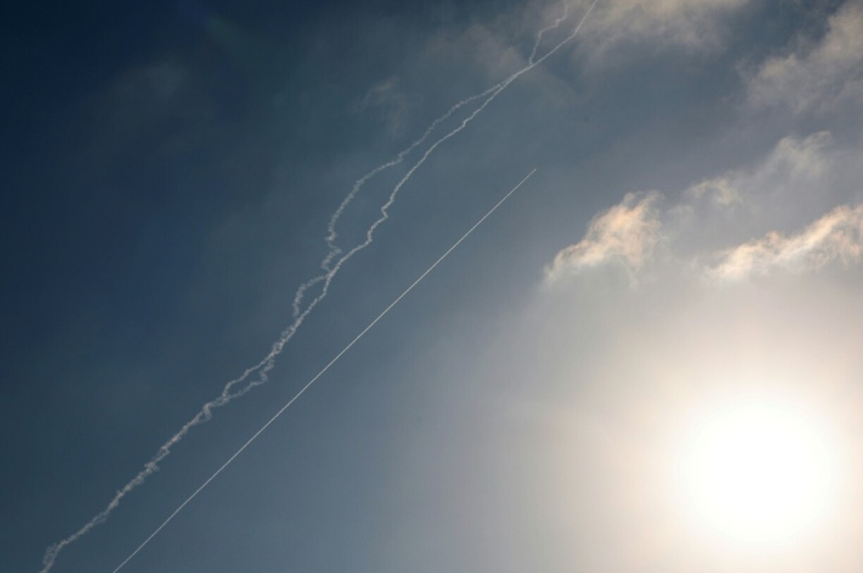 Rocket trails are seen in the sky above the Israeli coastal city of Netanya amid a fresh barrage of Iranian missile attacks