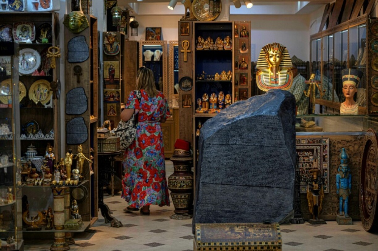 A tourist visits Philae Jewellery Bazaar near the Great Pyramids plateau in Giza
