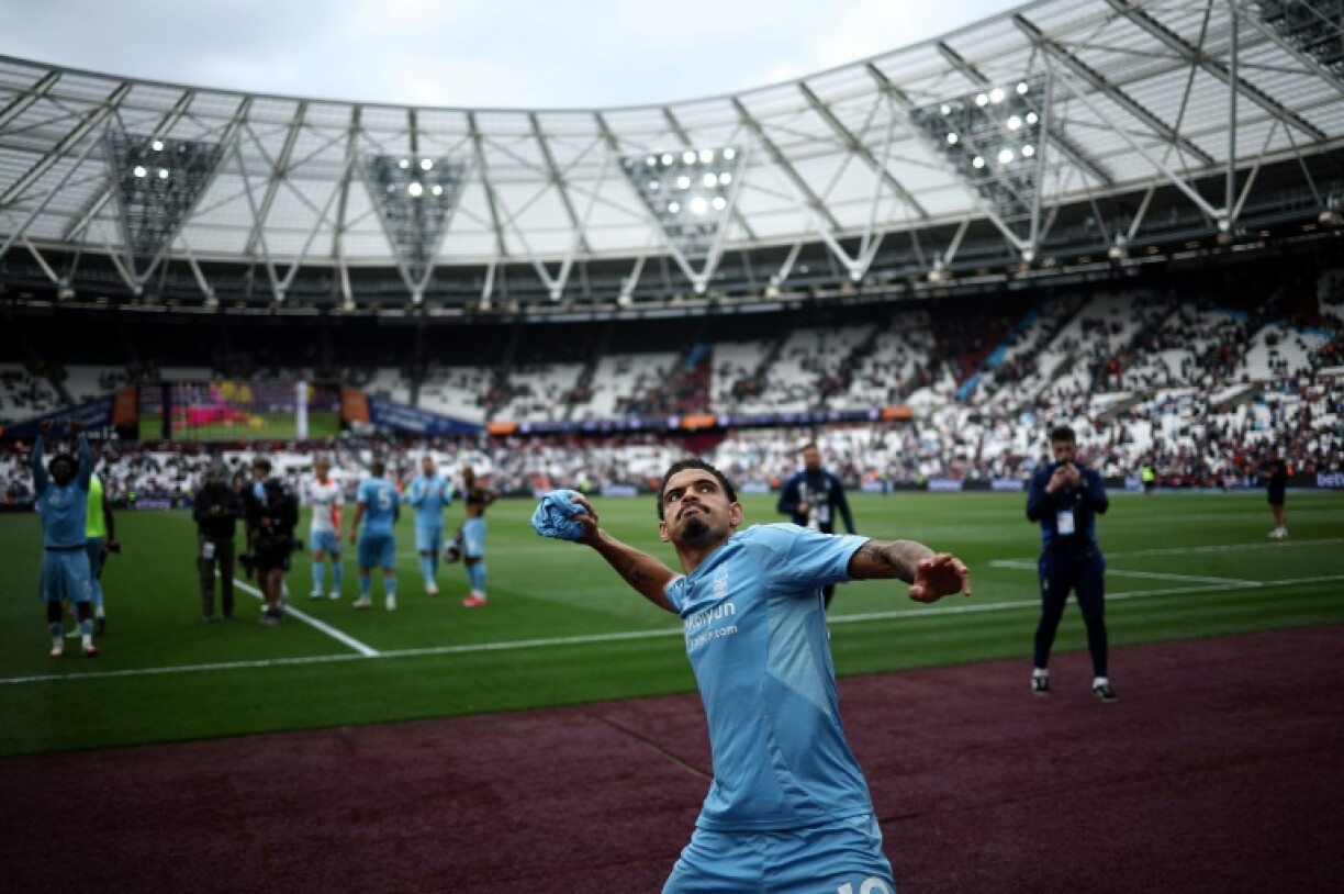 Nottingham Forest's Morgan Gibbs-White throws a shirt into the crowd