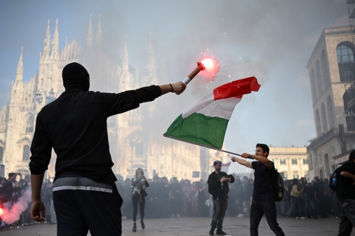 Violent clashes in Italy and Rome have weighed on the euro and sent stock markets in both countries lower