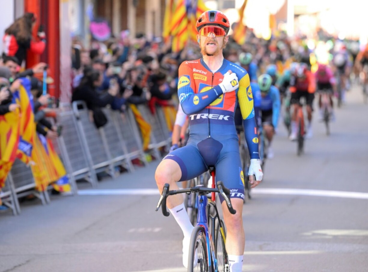 Team Lidl-Trek's US rider Quinn Simmons celebrates crossing the finish line of the sixth stage of the Tour of Catalonia