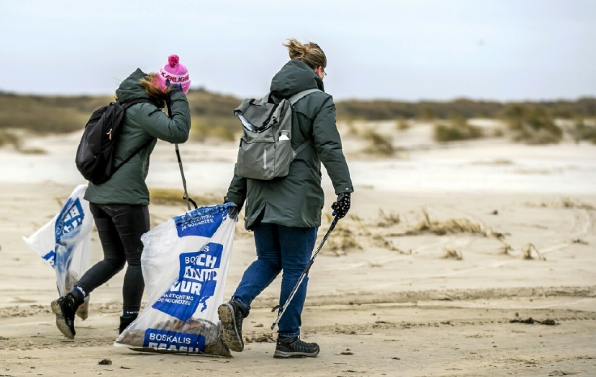 Volunteers clean up the contents of containers from the MSC Zoe spilled near Terschelling Island off the Netherlands