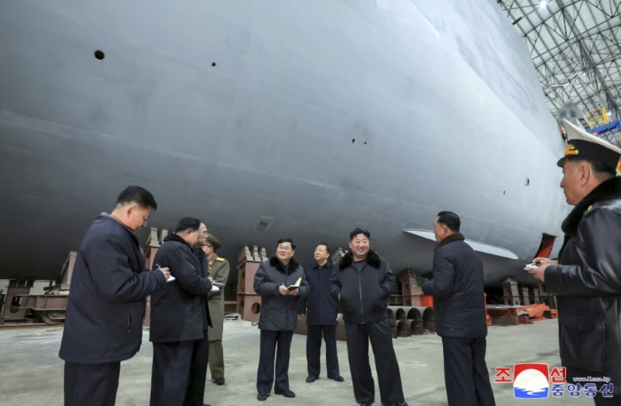 North Korean leader Kim Jong Un (3rd R) visited shipyards focused on building warships, the Korean Central News Agency reported