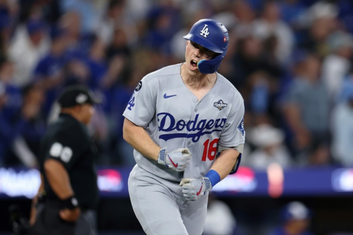 Los Angeles Dodgers catcher Will Smith celebrates after hitting a home run in the team's victory over the Toronto Blue Jays in game two of the World Series