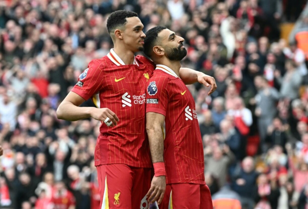 Liverpool's Mohamed Salah (R) celebrates with Trent Alexander-Arnold