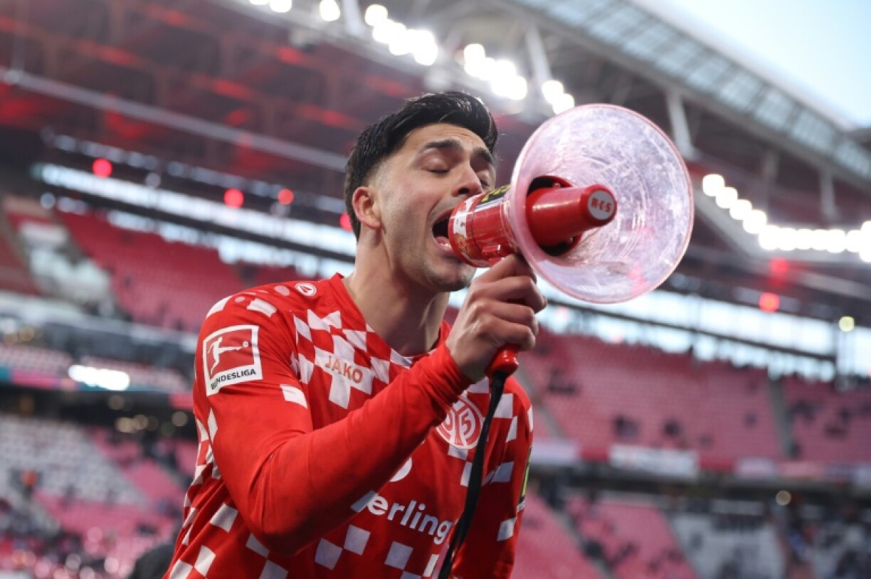 Something to shout about: Mainz midfielder Nadiem Amiri addresses fans after scoring in a victory at Leipzig