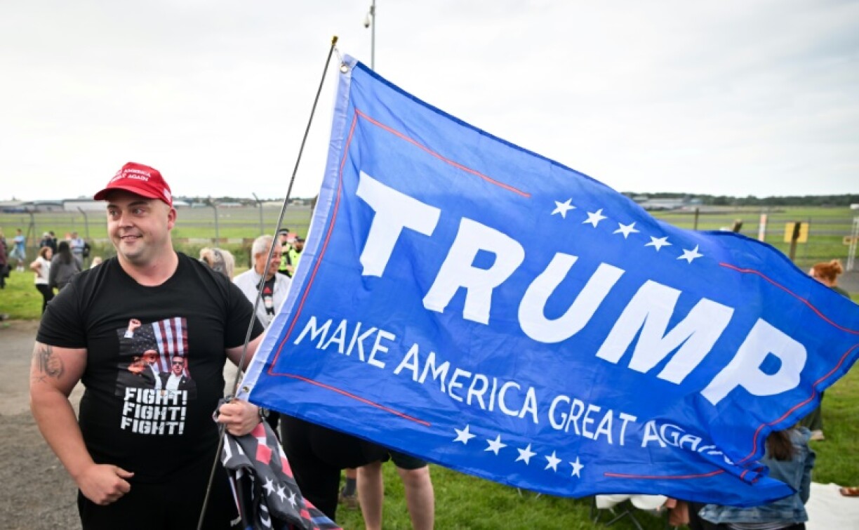 Some Trump supporters turned out to see Trump's plane land at Prestwick