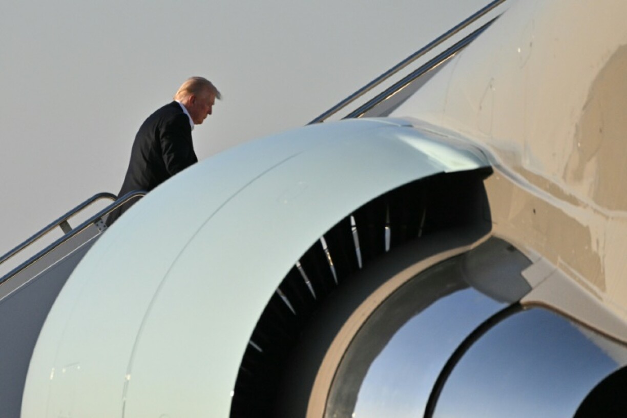 Trump boards Air Force One at Palm Beach International Airport in Florida as he returns to Washington, DC