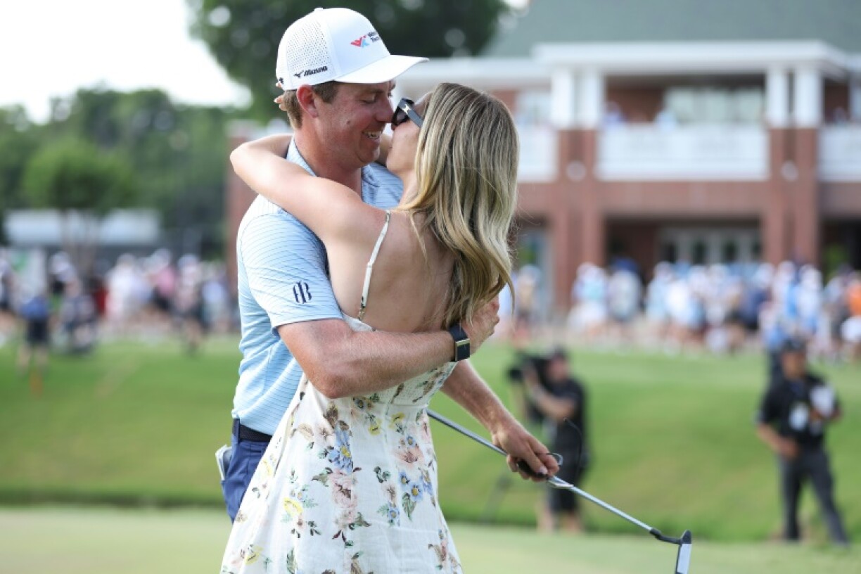 Ben Griffin of the United States celebrates with fiancée Dana Myeroff after winning the Charles Schwab Challenge at Colonial Country Club on Sunday.