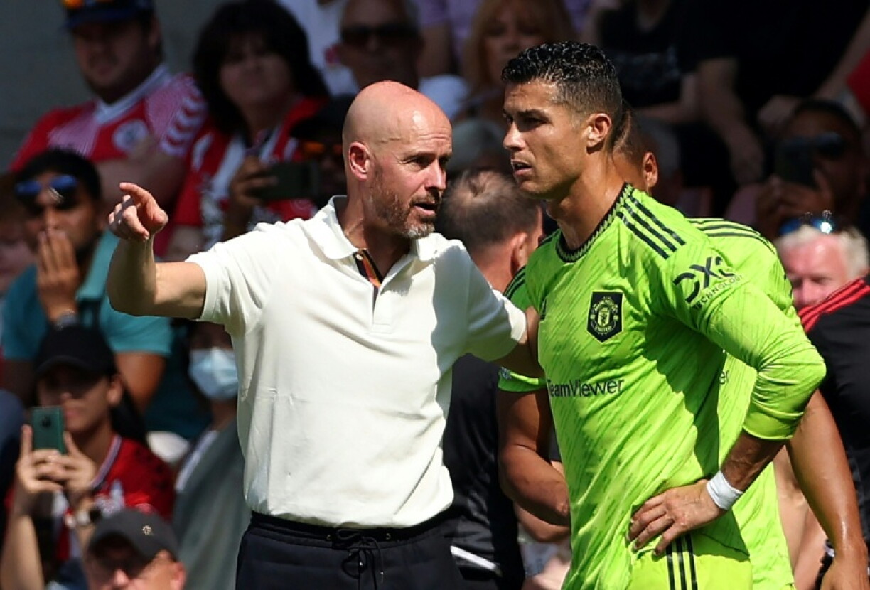 Former Manchester United manager Erik ten Hag speaking to Cristiano Ronaldo