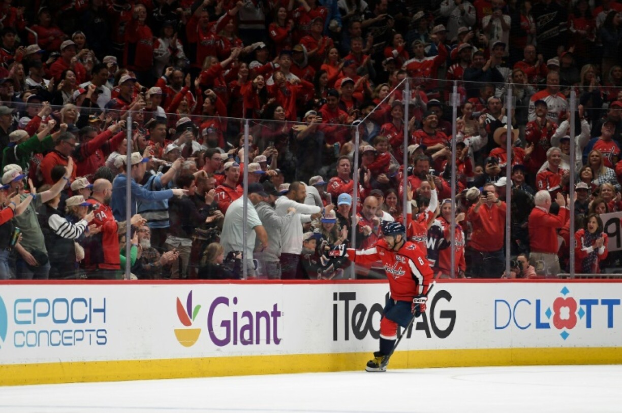 Alex Ovechkin celebrates with his son, Sergei, after scoring his 890th career NHL goal in his Washington Capitals' loss to the Buffalo Sabres