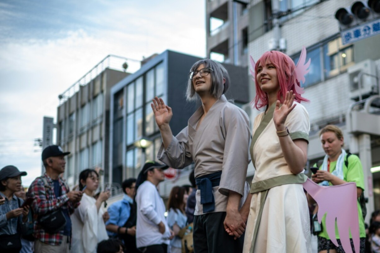 Des cosplayers participent à une parade lors de la deuxième journée du World Cosplay Summit 2026 à Nagoya, le 1er août 2026