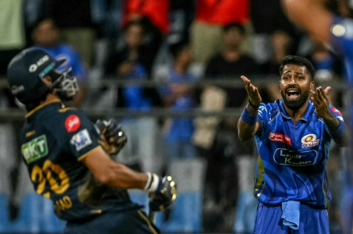 Hardik Pandya (R) missed a shy at the stumps as Arshad Khan completed the winning run