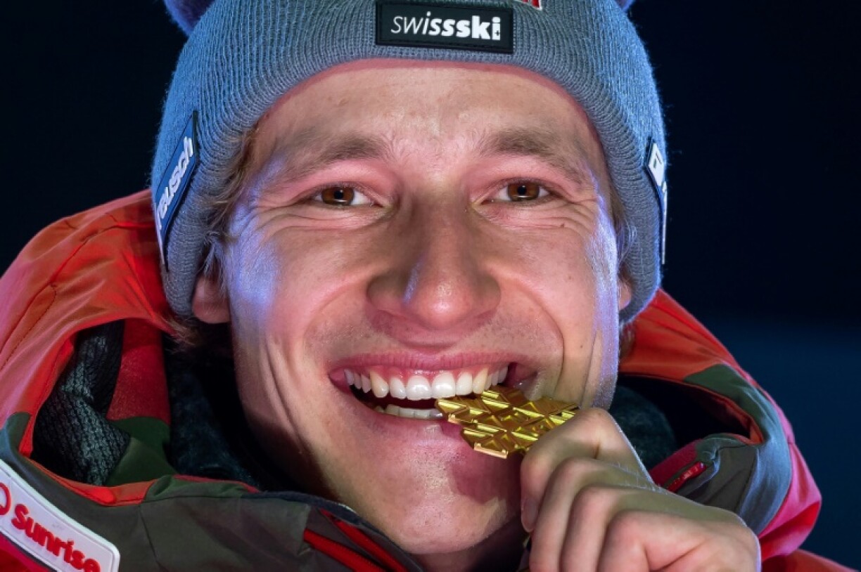 Switzerland's Marco Odermatt celebrates winning world super-G gold