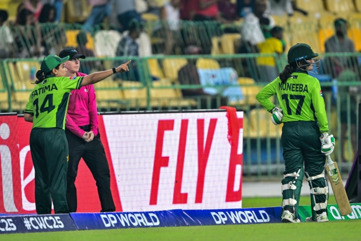 Pakistan's captain Fatima Sana (L) speaks to the umpire after the controversial dismissal of Muneeba Ali