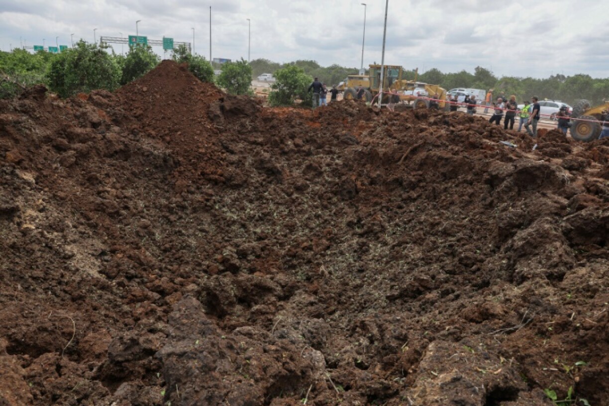 A police video showed officers standing on the edge of a deep hole in the ground