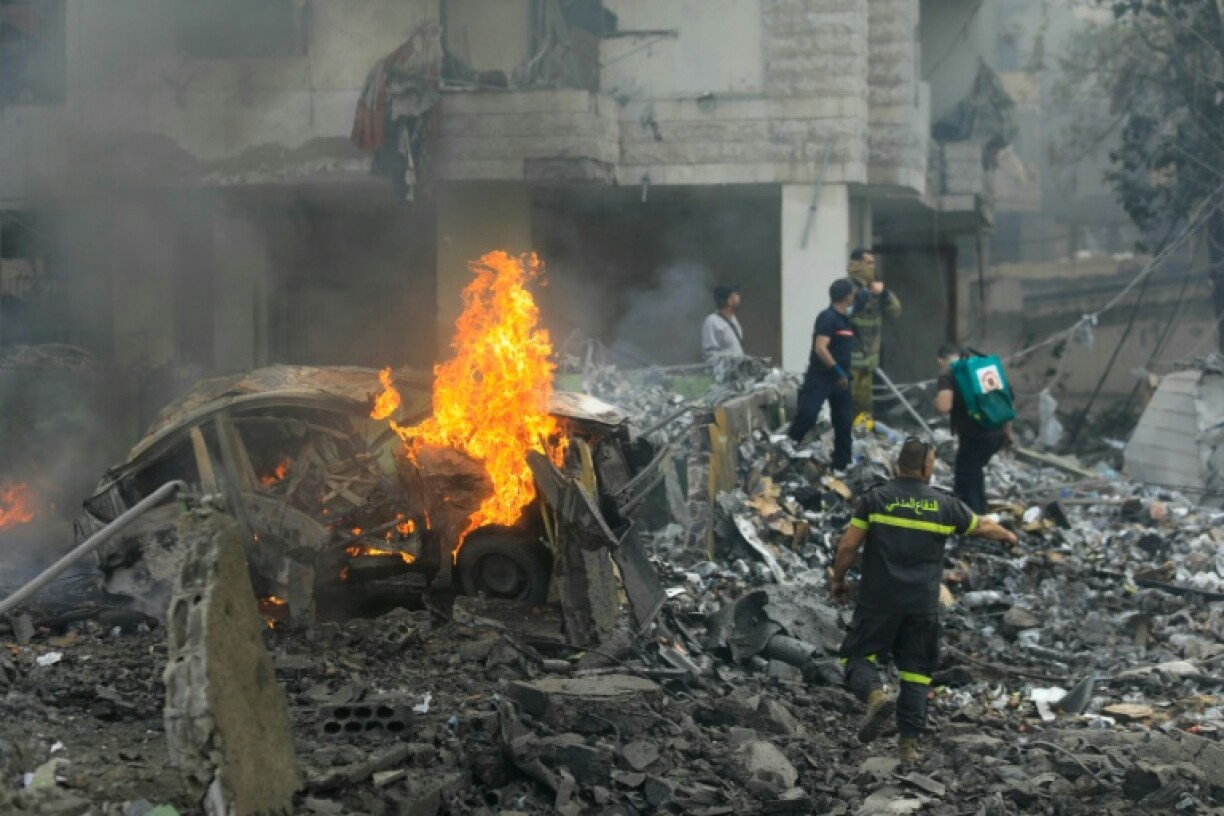 First responders arrive at the site of the Israeli strike on south Beirut